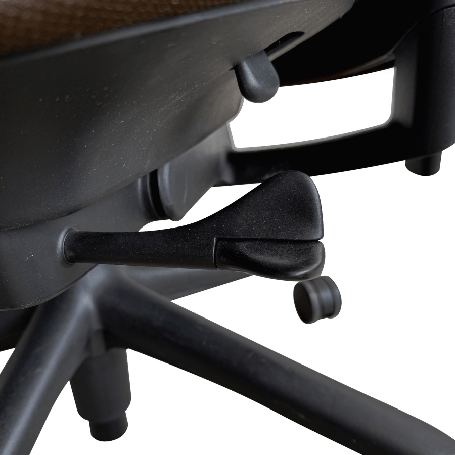 Close-up of adjustable levers on refurbished Herman Miller Sayl office chair base