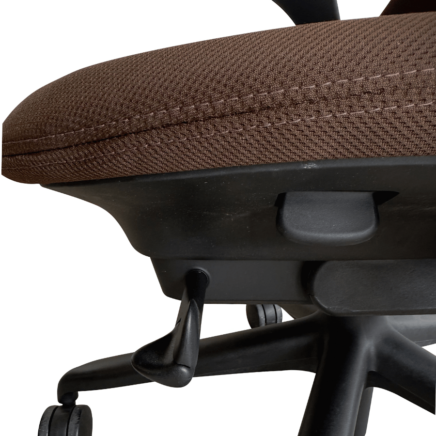 Close-up of adjustable brown mesh seat on refurbished Herman Miller office chair