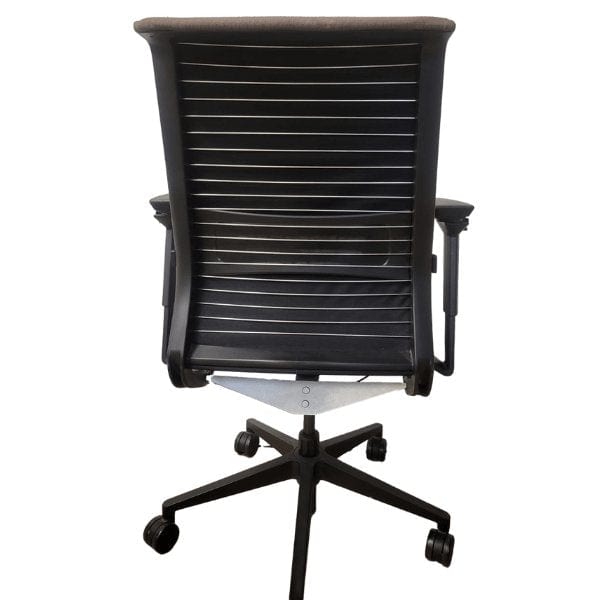 Rear view of a refurbished Steelcase Think office chair with black frame and casters