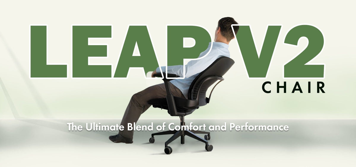 Steelcase Leap V2 chair with black base, person seated, comfort-focused office chair