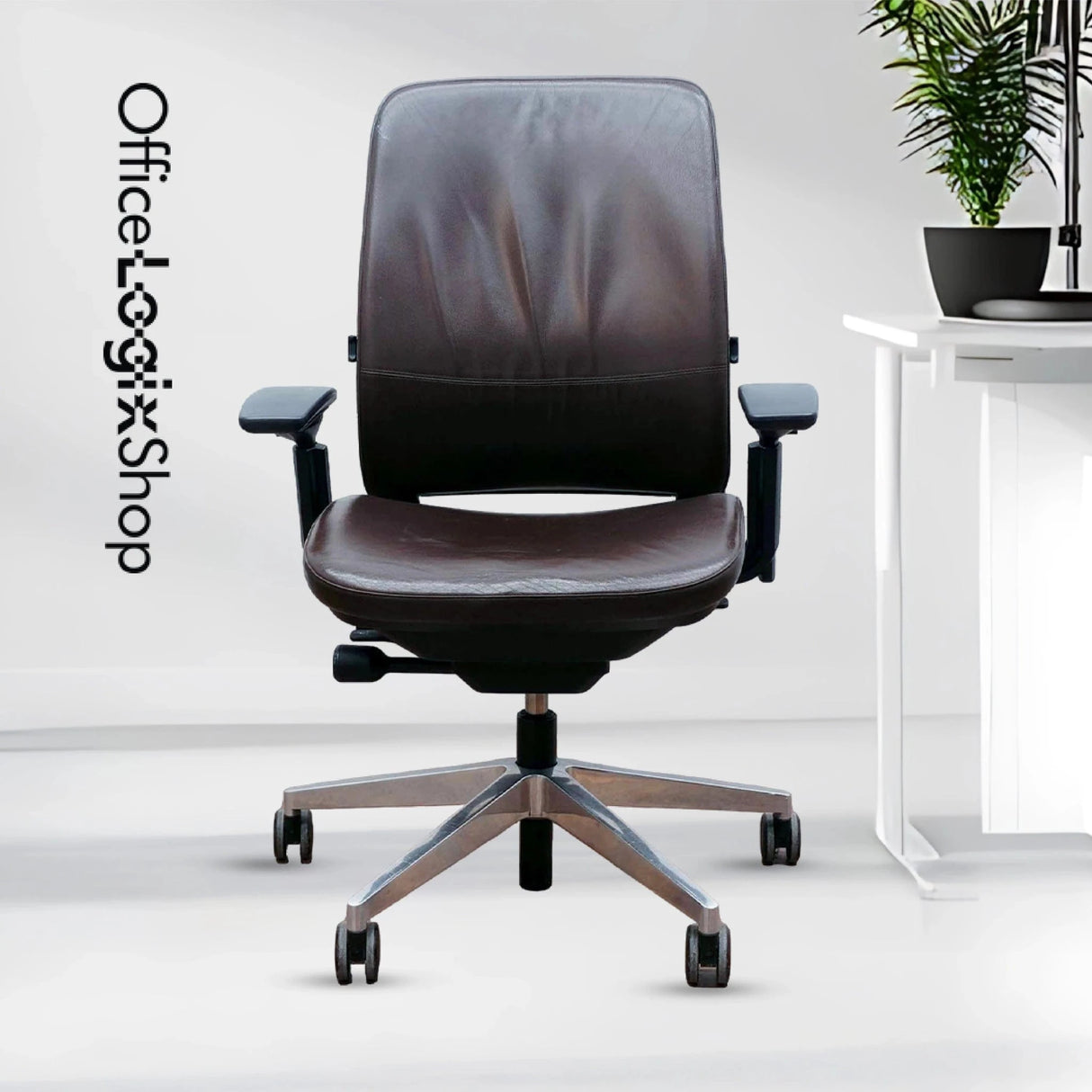 Refurbished Steelcase Amia brown leather office chair with platinum frame in modern office.