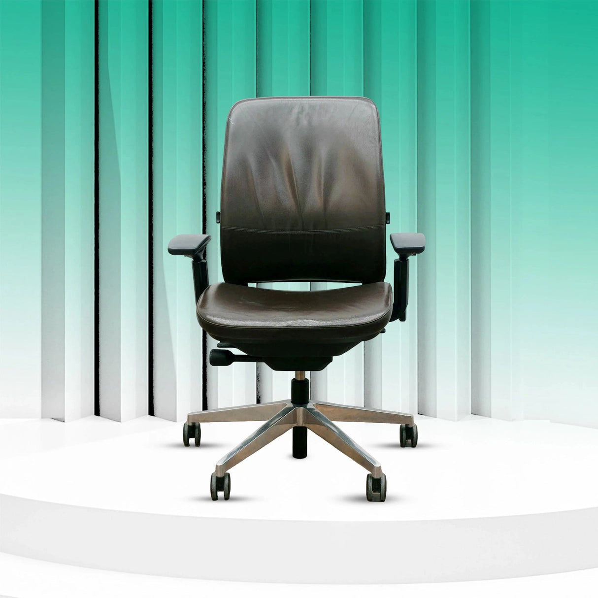 Refurbished Steelcase Amia brown leather office chair with platinum frame on display