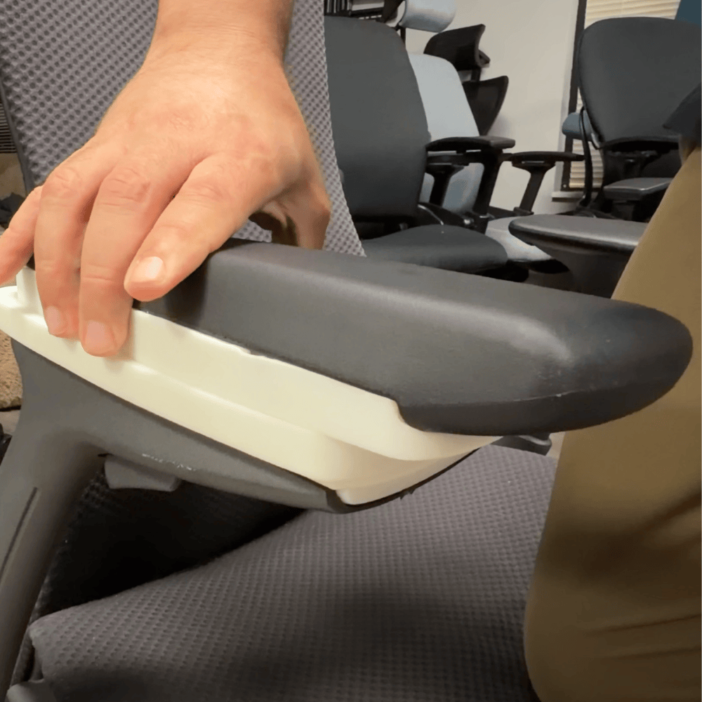 Hand moving the 3D arm pad on an Embody arm
