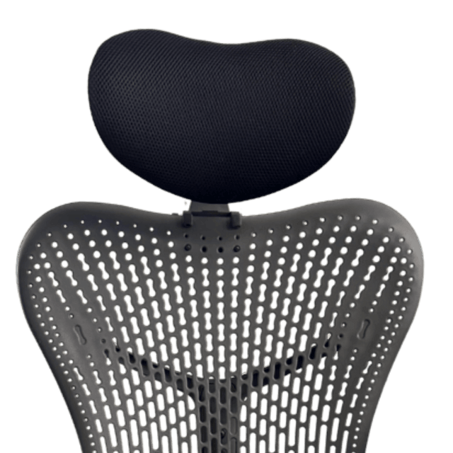 Headrest cushion above the back of a graphite Mirra 1, front view, green background