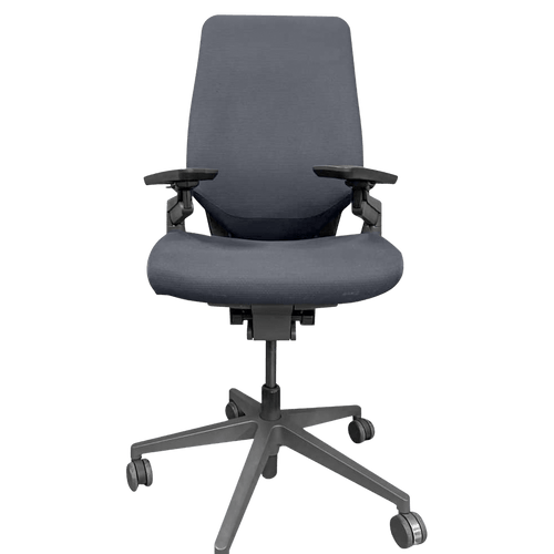 Steelcase Gesture in graphite gray fabric on a dark frame, front view on a green background